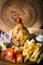 Chicken Gyros kebab served with bread,french fries and salad Royalty Free Stock Photo