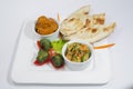 Chicken Harialy Kabab, Chicken Tikka masala curry, Indian Style mix vegetable , plain nan and Green Salad Platter.