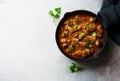 Chicken hearts stewed in tomato sauce in a skillet