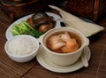 Chicken herb soup with abalone and scallop in pot