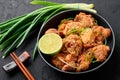 Chicken Karaage in black bowl at dark slate background. Karaage is traditional japanese cuisine dish