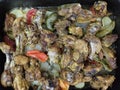 chicken karahi in a dish on a dark background S