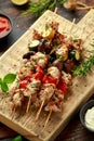 Chicken kebab, BBQ, skewers with mushrooms, red sweet pepper, zucchini and beer. Party food