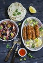 Chicken kebab, salad with tomatoes, onions and olives, homemade tortilla is a healthy and delicious meal Royalty Free Stock Photo