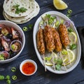 Chicken kebab, salad with tomatoes, onions and olives, homemade tortilla is a healthy and delicious meal Royalty Free Stock Photo