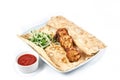 Chicken kebab with sauce in a restaurant Royalty Free Stock Photo