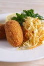 Chicken Kiev cutlet with pickled cabbage and mashed potato Royalty Free Stock Photo
