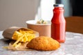 Chicken kiev cutlets close-up. Salad, drink and french fries. Fast food on the street Royalty Free Stock Photo