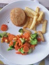 Chicken Kiev and vegetables Royalty Free Stock Photo