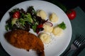 Chicken Kiev with vegetables and mashed potatoes on a white plate. Royalty Free Stock Photo