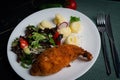 Chicken Kiev with vegetables and mashed potatoes on a white plate. Royalty Free Stock Photo