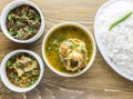 chicken korma, dal chana, kala bhuna gosht, chicken curry, plain rice with onion, pepper and salad served in a dish isolated on