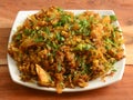 Chicken Kothu Parotta or Curried Shredded Indian flatbread a popular South Indian street food. made with layered bread pieces and Royalty Free Stock Photo