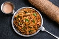 Chicken Kothu Parotta a popular South Indian street food in Kerala made with shredded Porotta Royalty Free Stock Photo