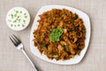 Chicken Kothu Parotta a popular South Indian street food in Kerala made with shredded Porotta Royalty Free Stock Photo