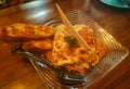 Chicken Lasagna with fried garlic bread on a plate