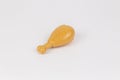 chicken leg plastic toy child on a white background Royalty Free Stock Photo