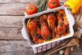 Chicken legs baked in tomato sauce horizontal top view Royalty Free Stock Photo