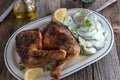 Chicken legs with cucumber salad on a plate Royalty Free Stock Photo