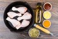 Chicken legs in frying pan, bottle of oil, tomato ketchup Royalty Free Stock Photo