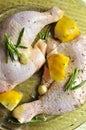 Chicken legs with lemon and rosemary ready to cook Royalty Free Stock Photo