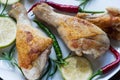 Chicken legs on white plate with rosemay and lime Royalty Free Stock Photo