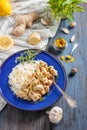 Chicken with lemon, curry, ginger and rice. Eastern, Indian, Asian cuisine