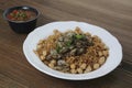 Chicken liver noodles with chickpea, tomato and chilli sauce served in dish isolated on table side view of arabic food Royalty Free Stock Photo