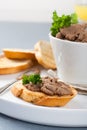 Chicken liver pate on bread and in bawl Royalty Free Stock Photo