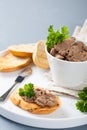 Chicken liver pate on bread and in bawl Royalty Free Stock Photo