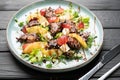 chicken liver salad with caramelized pear and balsamic sauce on plate. Royalty Free Stock Photo