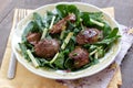 Chicken liver and spinach salad with green apple and onion