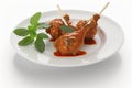 Chicken lollipop recipes, raw chicken on a white dish