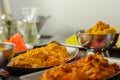 Chicken Madras and Chicken Tikka Masala with Pilau Rice, Naan Breads and, Onion Bhajis