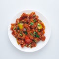 Chicken Manchurian is Indian Chinese cuisine dish with Chicken breasts, bell pepper, tomatoes, soy sauce