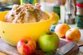 Chicken marinade and apples on the kitchen Royalty Free Stock Photo