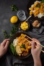 A Chicken Massaman Curry in black bowl at dark background. Royalty Free Stock Photo