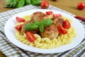 Chicken meat balls, pasta fusilli, tomatoes, basil Royalty Free Stock Photo