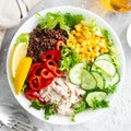 Chicken meat lunch bowl with fresh salad leaves, corn, cucumber, sweet pepper and quinoa Royalty Free Stock Photo