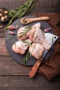 Chicken meat - Raw uncooked drumsticks or legs on slate with ingredients for cooking. Top view