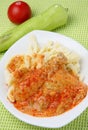 Chicken meat in red pepper sauce with pasta