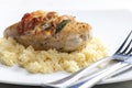 chicken meat on sage baked with bacon and served with couscous Royalty Free Stock Photo