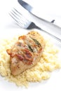 chicken meat on sage baked with bacon and served with couscous Royalty Free Stock Photo