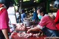 Chicken meat seller wearing masks at Giwangan Market