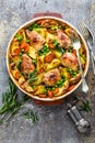 Chicken meat, thighs baked with potato, carrot and green peas