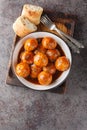 Chicken meatballs in honey glaze and spicy sauce close-up in a bowl. Vertical top view Royalty Free Stock Photo