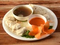 Chicken momo and chicken soup, Nepalese Traditional dish Momo stuffed with chicken and then cooked and served over a rustic wooden