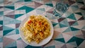 Chicken mushroom pepper sauce with brown rice with glass of water Royalty Free Stock Photo