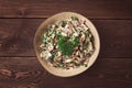 Chicken and mushroom salad, with herbs, seasoned with white sauce, close-up, rustic style,on a wooden table, toned, Royalty Free Stock Photo