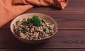 Chicken and mushroom salad, with herbs, seasoned with white sauce, close-up, rustic style,on a wooden table, toned, Royalty Free Stock Photo